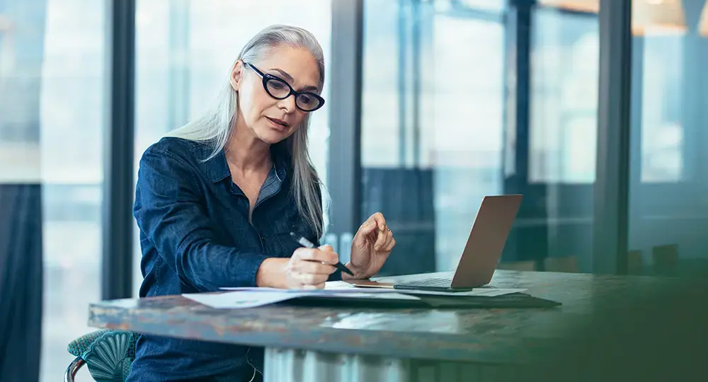 Woman in finance working at laptop