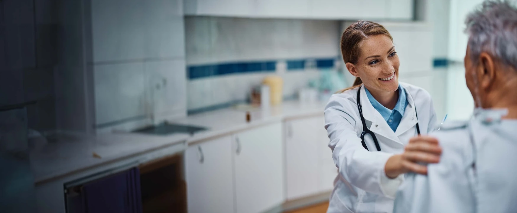 A doctor speaking with her patient in a clinic