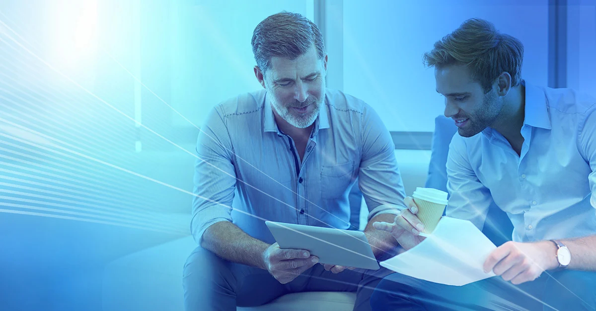 Two businessmen looking over documents