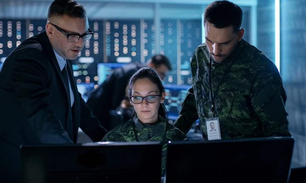 A defense team works in a war room