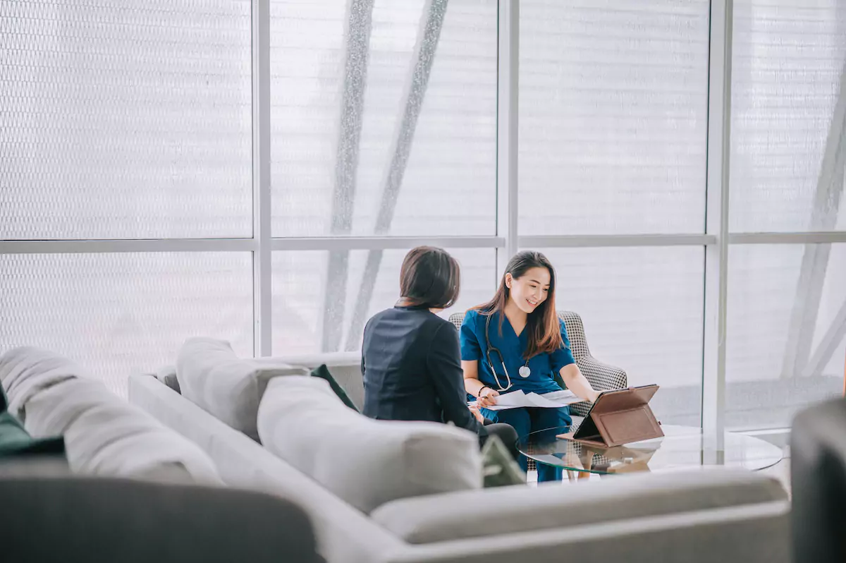 Doctor reviewing documents with a patient