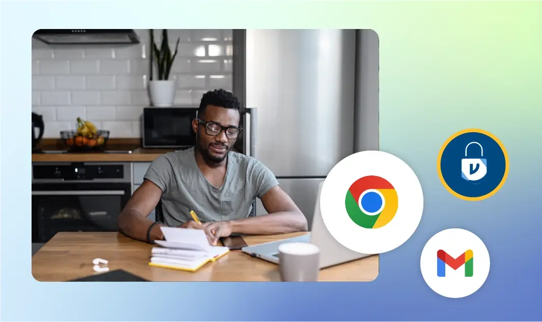 A man works from home on his personal laptop, writing notes in a yellow notepad.